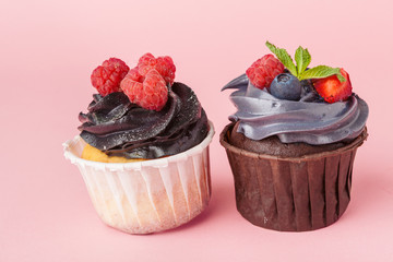 Yummy cupcake on light pink background close up