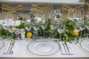 Decorated with Decor and Floristics table and a choice of glasses for a different sort of Wine for Tasting in honor of the holiday of young wine in France and Italy or a Wedding party Top viev