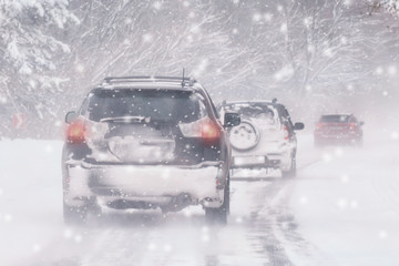 Winter, snow, Blizzard, poor visibility on the road. Car during a Blizzard on the road with the...