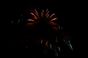 Awesome isolated Festive fireworks on a dark background. Can be used as wallpaper or background