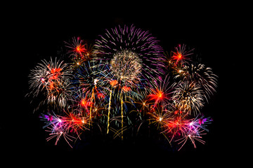 Awesome isolated Festive fireworks on a dark background. Can be used as wallpaper or background