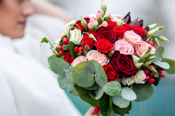 Bouquet of flowers in the hand of the bride