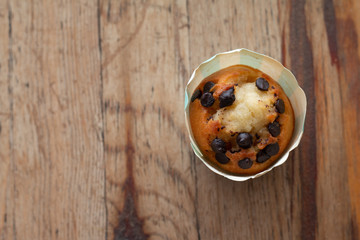 Cupcake on wooden table background