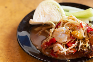 Thai's spicy Papaya salad healthy food on wood table