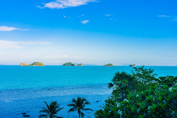 Beautiful outdoor beach sea ocean with coconut palm and other tree around island for travel in holiday vacation