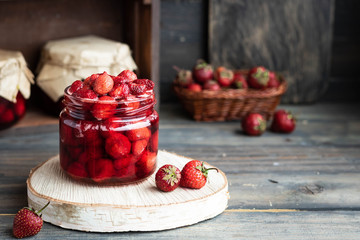 Strawberry jam in a glass jar