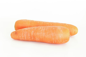 Fresh carrot and cut pieces isolated on white background