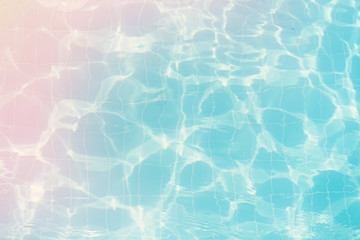 Water vibrations in the swimming pool with sun reflection. blue swimming pool surface, water background in swimming pool. Flat lay, top view