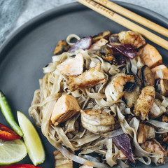 Noodles wok for Asian cooking with seafood