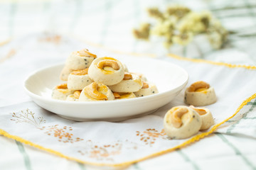 Cookies Singapore or cashew Cookies with dried vintage flower on vintage background