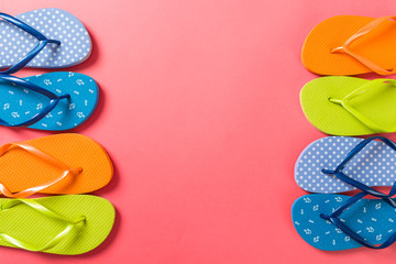 a lot of flip flop colored sandals, summer vacation on colored background, copy space top view