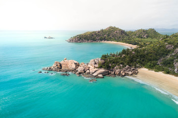 Beach aerial with palm trees, blue turquoise ocean and white sand. Magazine cover for travel, lifestyle, fashion