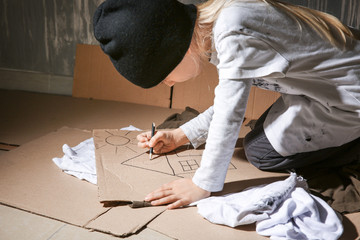 Homeless little girl dreaming about home