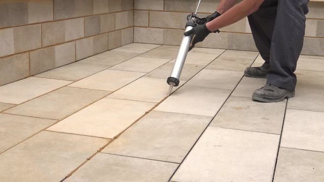 Grouting tiles
