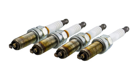 Car spark plugs that have been used for more than 10,000 kilometers isolated on white