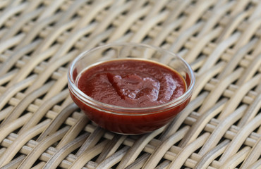 Smoked red bbq sauce in glass bowl