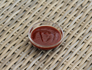 Smoked red bbq sauce in glass bowl
