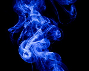 Blue smoke on black background
