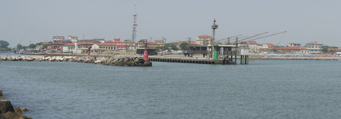 Porto Garibaldi panorama from the walk along the pier to the lighthouse.  Porto Garibaldi is a fishing village on the Adriatic Sea inside Po Delta national Park in Comacchio district.