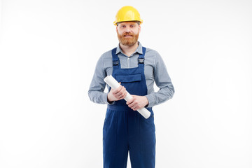 Engineer with drawings in his hands looking into the camera
