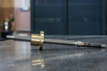 Bronze nut with steel screw for lathe.