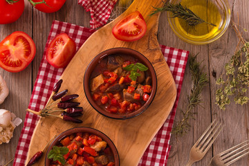 Marinated pork loin in tomato sauce.