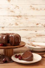 Composition with tasty chocolate cake on table