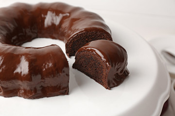 Tasty chocolate cake on dessert stand, closeup