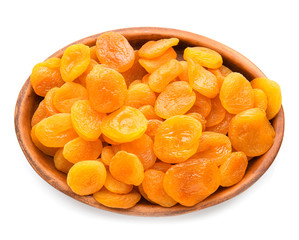 Plate with dried apricots on white background