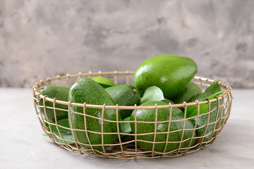 Fresh ripe avocados in basket