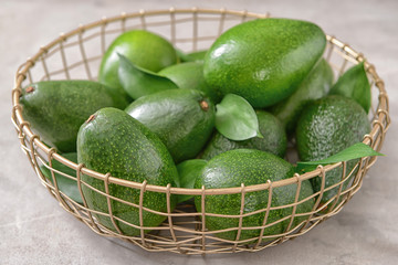 Fresh ripe avocados in basket