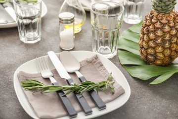 Beautiful table setting on grey background