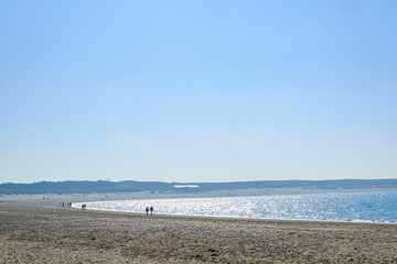 Beautiful Beach With Crystal Clear Blue Waters of The Sea Against Blue Sky on a summers day