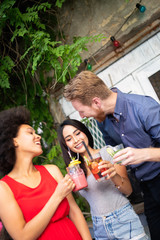 Multiracial group of friends having fun and talking