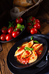 ravioli alla genovese with basil tomato sauce