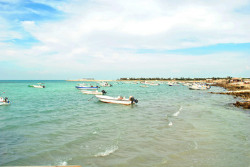 Fishing boat at the sea in sunny day