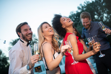 Group of friends having fun and celebrating group gathering