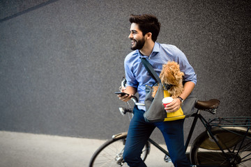 Lifestyle, transport, communication and people concept . Young man with bicycle and smartphone on...