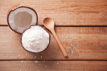 Coconut ice cream on the wooden table with mint leaf