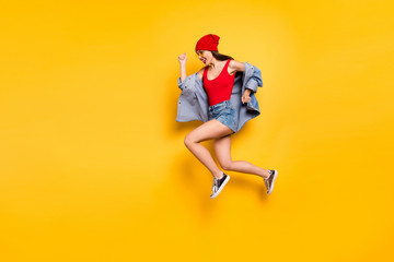 Fototapeta na wymiar Profile side full size photo of energetic trendy stylish lady jogging isolated over yellow background