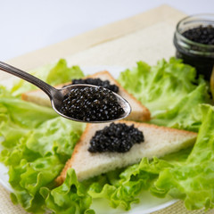 Sandwiches with black caviar