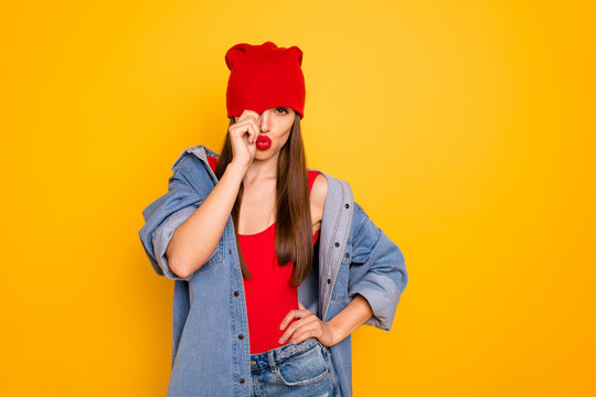 Portrait of charming trendy youth hide face send air kisses want date isolated over yellow background