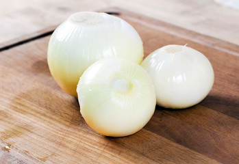 White onion on the wooden board