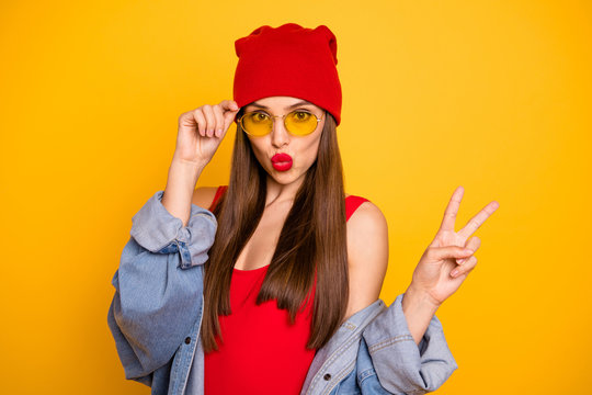 Close up photo of cute beautiful lady bright lips nice colorful look v-sign symbol send air kiss wear sun specs red body tank-top denim blazer