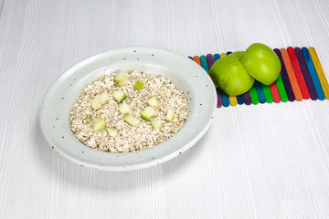 dish with oatmeal and pieces of apple and pear, Nutritious breakfast food healthy oatmeals