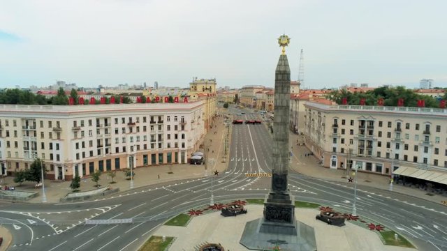 Victory Square in Minsk (Belarus) - Aerial View of National Landmark - Memorial Monument Obelisk for World War II Victory. 4K Drone Panning Shot on Cloudy Summer Day