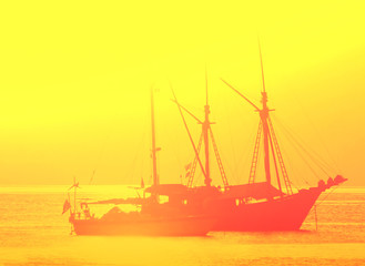 blur of boat in gold  sunset background