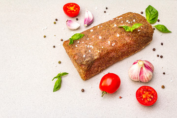 Raw pork loin with vegetables, species and herbs