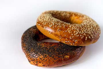 bagel with poppy seeds isolated on white