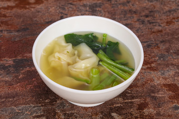 Asian traditional Wonton soup with herbs